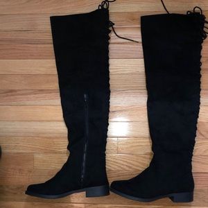 Thigh high black lace up boots